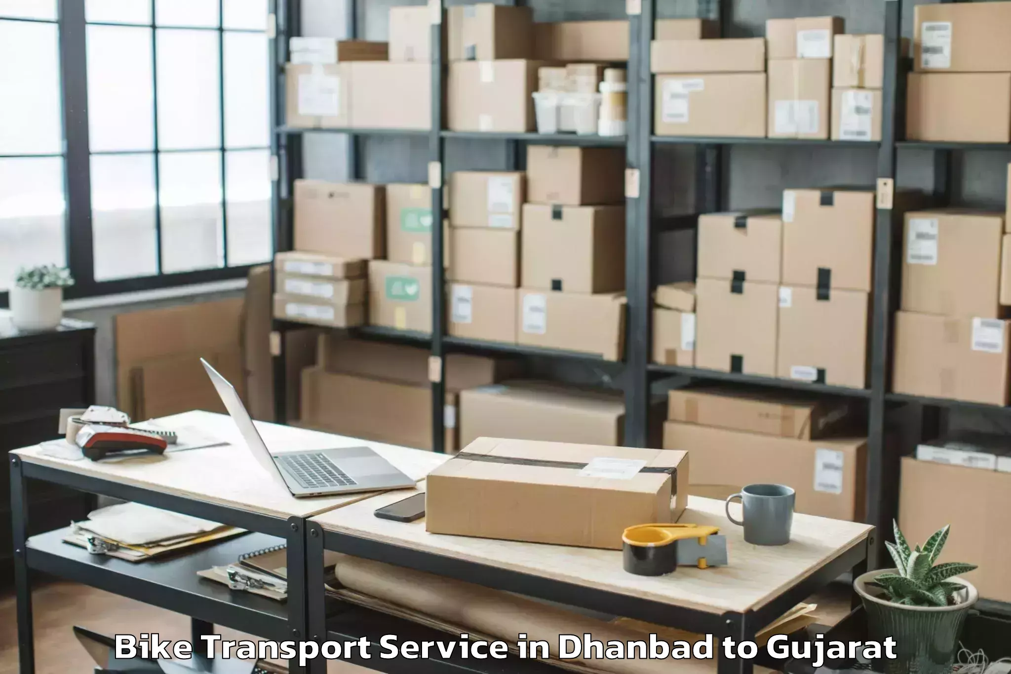 Top Dhanbad to Rajkot Airport Raj Bike Transport Available